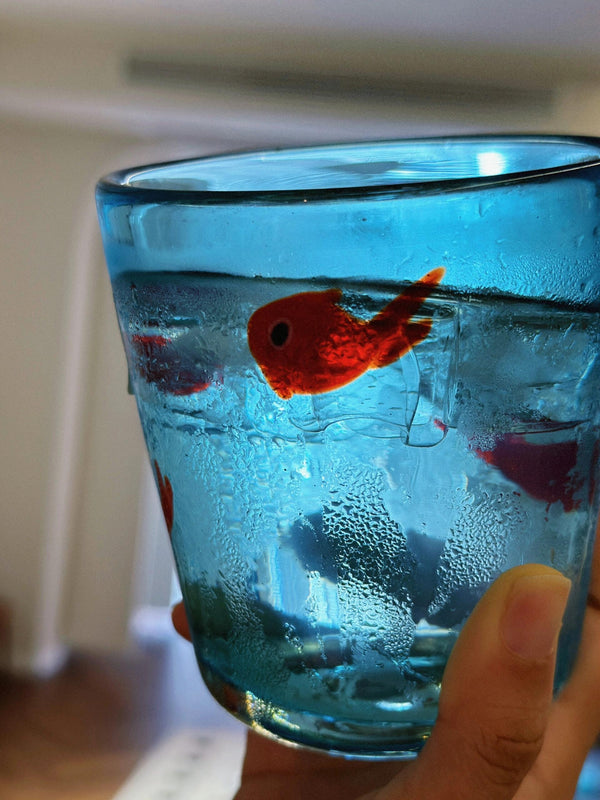 Whimsical Red Fish in Blue Glass: A Unique Drinking Vessel